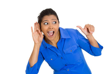 young nosy woman hand to ear gesture secretly listening 