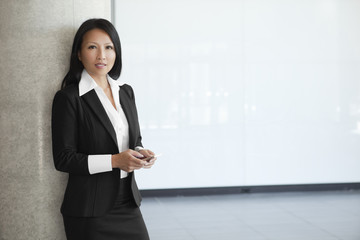 Asian Businesswoman Waiting For A Phone Call