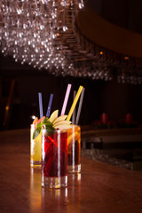 Cherry bomb, screwdriver and cuba libre cocktails in a tall glas