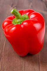 Red pepper on wooden background