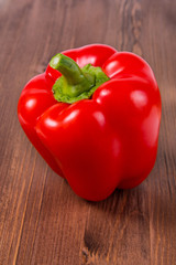 Red pepper on wooden background