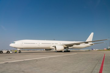 Fototapeta na wymiar White plane in airport