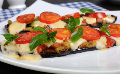 Baked eggplant with tomato and basil and cheese