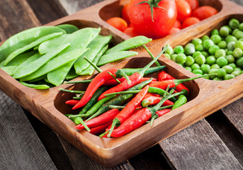 Fresh green peas, tomato and chili