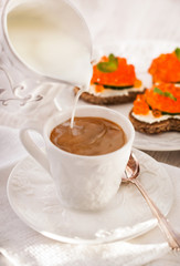 Romantic breakfast with coffee and toasts