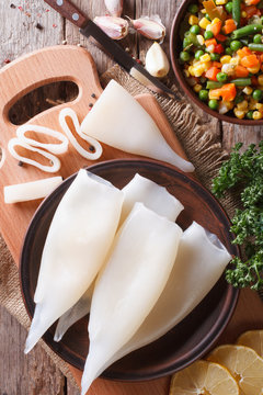 Preparation of raw squid and ingredients vertical top view