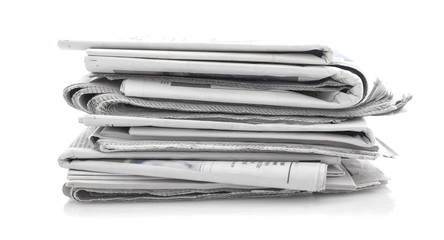 newspapers over white background