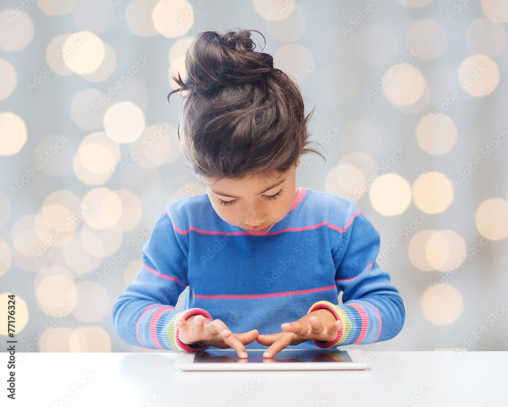 Canvas Prints little girl with tablet pc over lights background