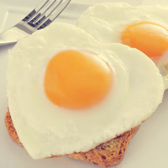 heart-shaped fried eggs, with a filter effect