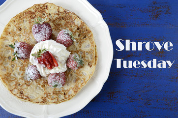 Shrove Tuesday pancakes with strawberries and cream