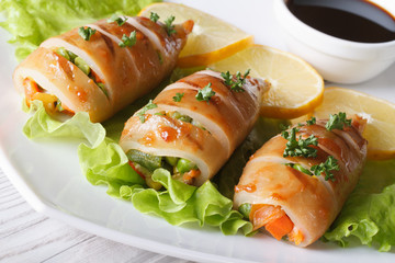 Grilled squid stuffed with vegetables close-up, horizontal