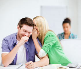 Fototapeta premium group of students gossiping at school