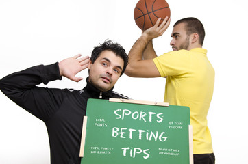 Sports betting tips, a guy holding a blackboard eavesdropping