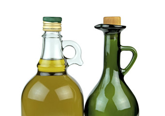 Extra virgin olive oil in glass bottles on white background.