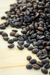 Close up roasted coffee beans on wooden background