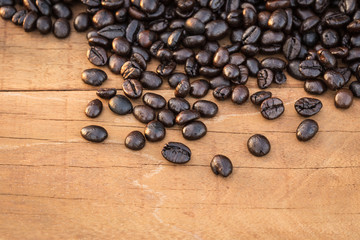 Coffee beans on wood background