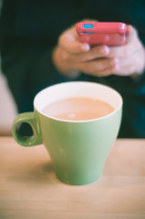 Woman taking picture of meal by smartphone.