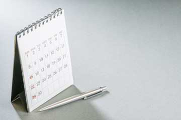 Calendar.Office supply on Blank desk.