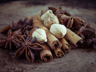 cinnamon sticks and star anise on  wood background