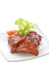 thai pork fried on white ceramic dish