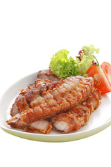 thai pork and herb fried on white ceramic dish