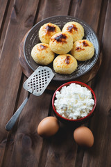 Curd pancakes and ingredients, high angle view