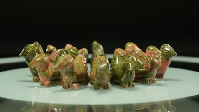Rotating unakite carved rooster figurines