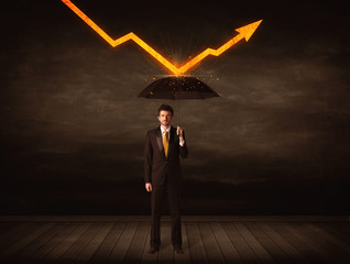 Businessman standing with umbrella keeping orange arrow