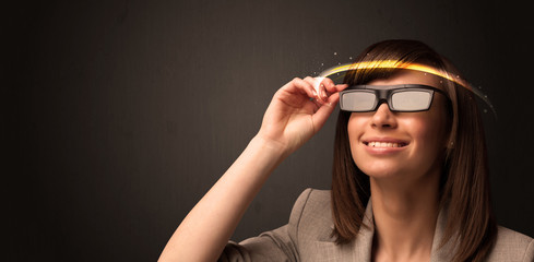 Pretty woman looking with futuristic high tech glasses