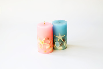 Two Wax Candles on White Background