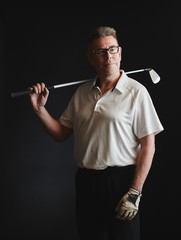 Mature man golfer and golf club