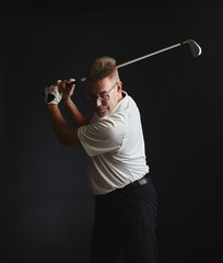Mature man golfer and golf club