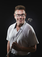 Mature man golfer and golf club