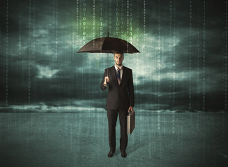 Business man standing with umbrella data protection concept
