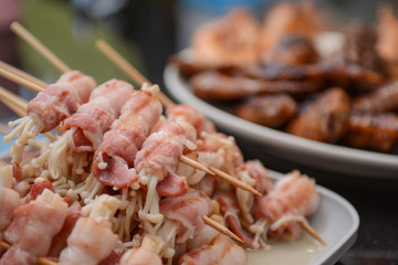 grilled golden needle mushroom roll with bacon