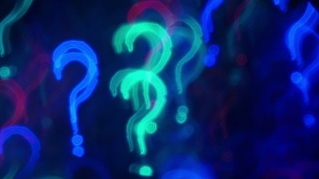 Question marks. Out of focus lights background. 4K UHD 2160p