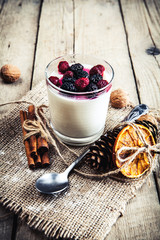 Serving of frozen creamy ice yoghurt with fresh mulberry