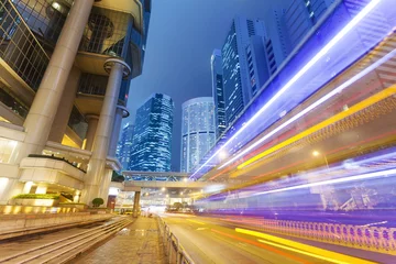Tuinposter Traffic in the financial district of Hong Kong at night © ymgerman