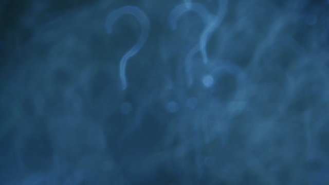 Question marks. Out of focus lights background. 4K UHD footage.