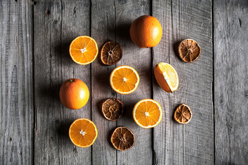 Beautiful background of fresh sliced oranges and dried slices