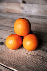 fresh, oranges on  a wooden background
