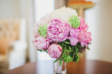 beautiful wedding bouquet with rings on a table