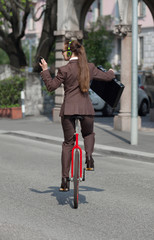 Businesswoman with unicycle