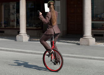 Businesswoman with unicycle © alexandre zveiger