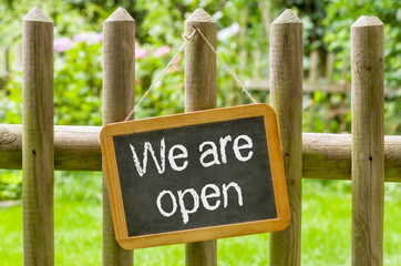 Blackboard with the inscription We are open