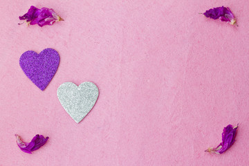 Purple hearts and flower petals