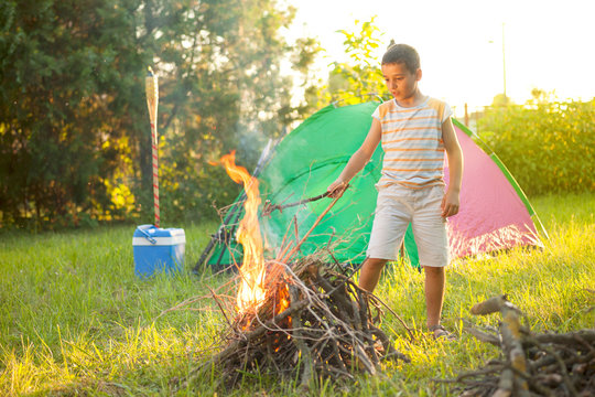 Children On A Camping Trip Learning How To Read And Use A Map