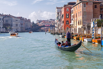 Fototapeta na wymiar Morning cruise in Venice gondola on the Grand Canal