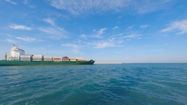 Container ship leaving port - Time lapse