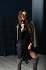 Fashion Military Style. Model in jacket, skirt and boots posing